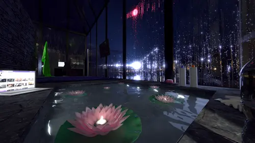 An image of the inside of streamer, Ariette's hirise apartment. In the center sits a modern hot tub which is built into the slate flooring. The hot tub is filled with lilly pads floating on the surface of the water, on top sit fake pink flowers with a lit candle inside them. Off to the side of the hot tub is a laptop with a streaming web site open, along the other side are some soap and hair products. Off the side of the hot tub close to the viewer slightly off camera is a water bottle. Further in the background we can see a computer set up and a green screen off to the side. The apartment is surrounded with large glass windows that span from the floor all the way to the ceiling. On a pane supporting one of the window approximately halfway to the back of the apartment is a mounted flat screen TV. The windows, covered in rain, look out to the city with a tone of bright lights and a glowy red moon.